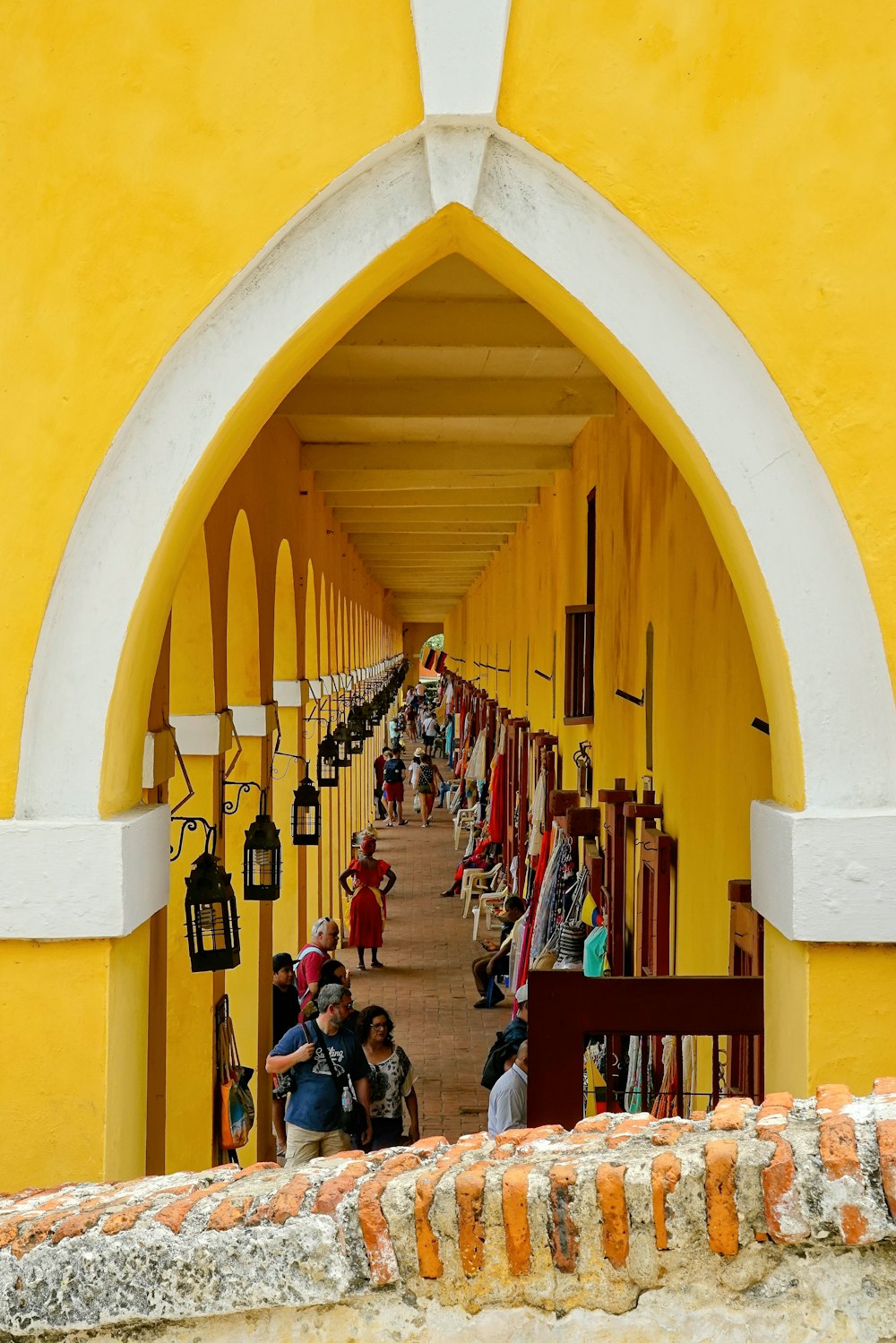 people in yellow building