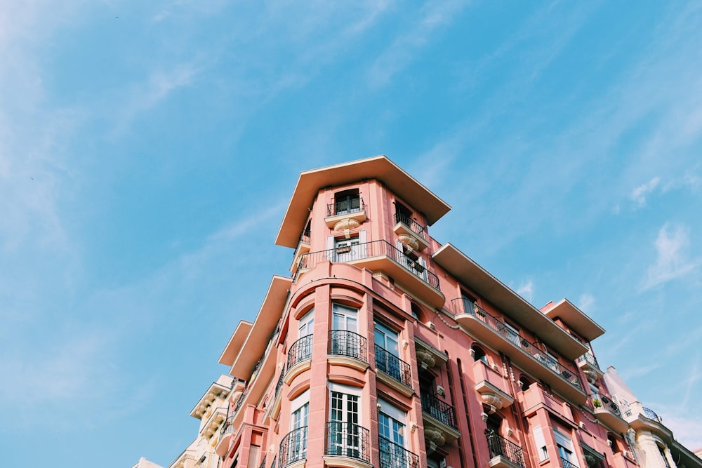 pink concrete building under blue sky