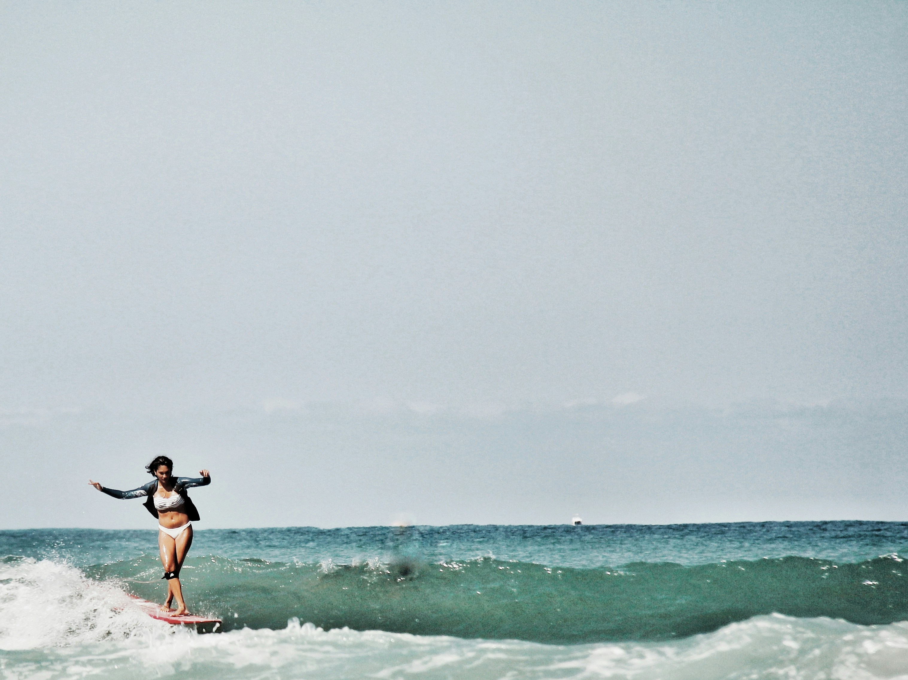 Woman surfing in Biarritz, France
