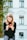 woman holding slice of watermelon while sitting on concrete bench outdoor