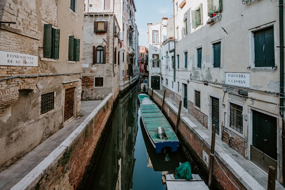 blue boat on canal