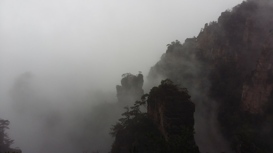 misty rock formation at daytime, zhangjiajie