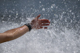 A minimalist shot of a bracelet under gentle running water, emphasizing durability.