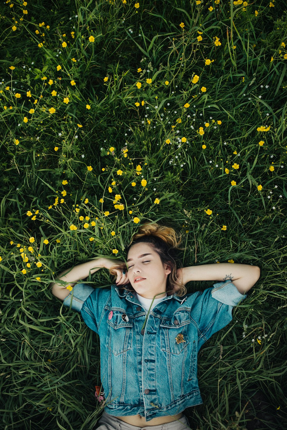 woman lying on grassland