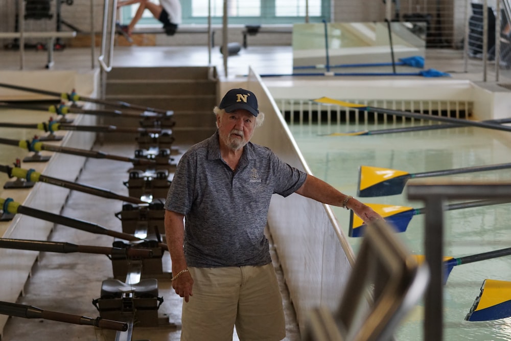 man standing between paddles