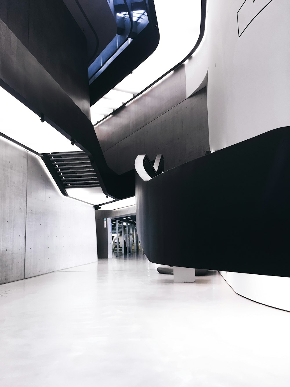 a white and black building with a skylight