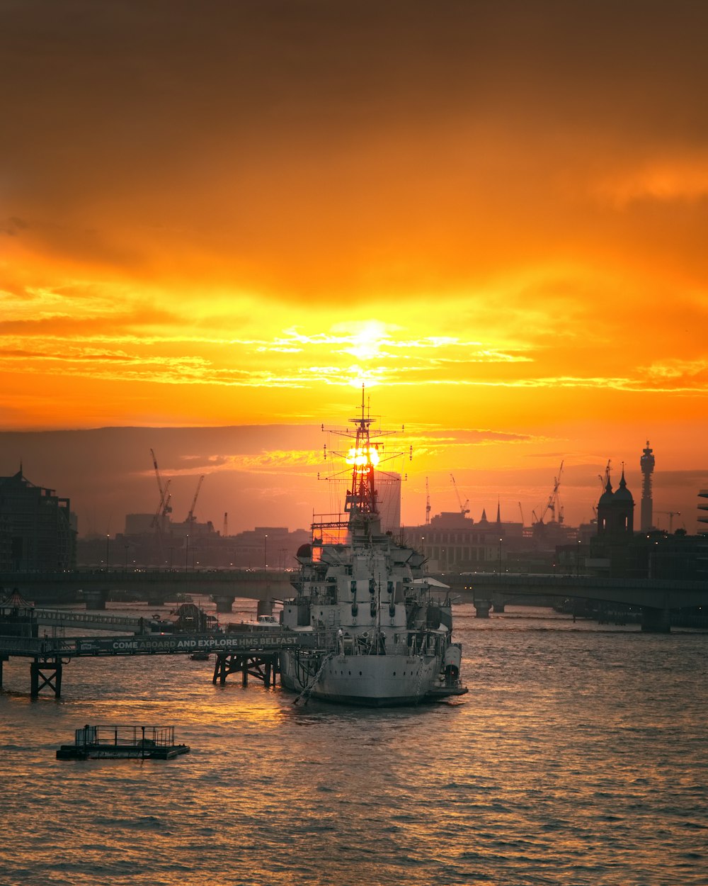 ship docked beside bridge