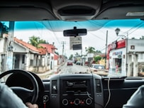 man holding steering wheel