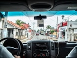 man holding steering wheel