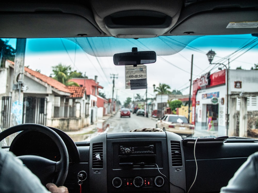 man holding steering wheel