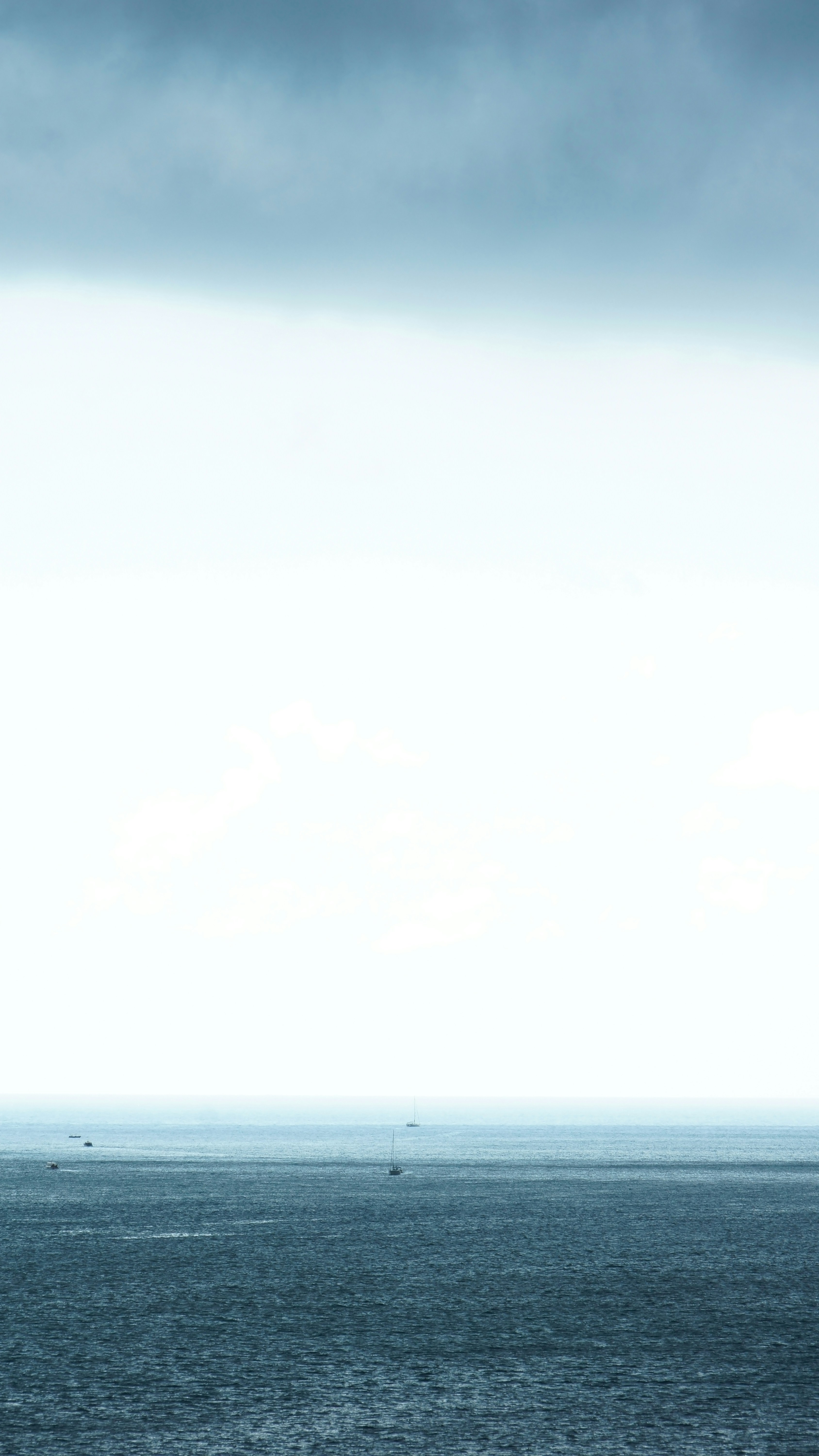 body of water under gray cloudy sky