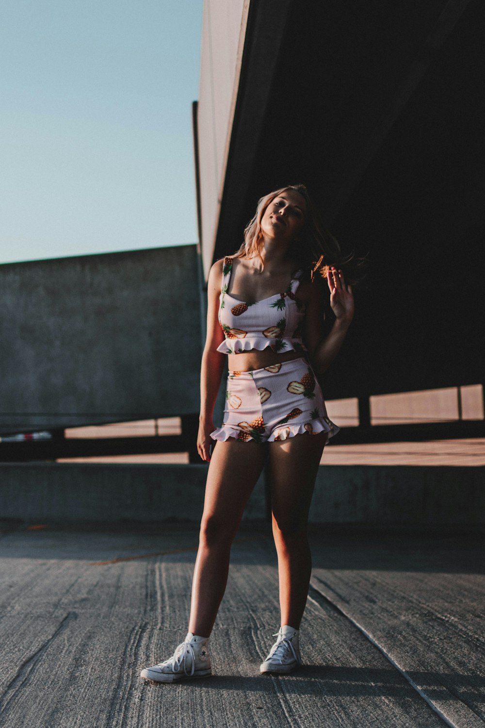 woman standing under bridge