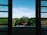 A sparkling clean window showcasing a clear view of the outdoors.