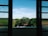 A sparkling clean window showcasing a clear view of the outdoors.