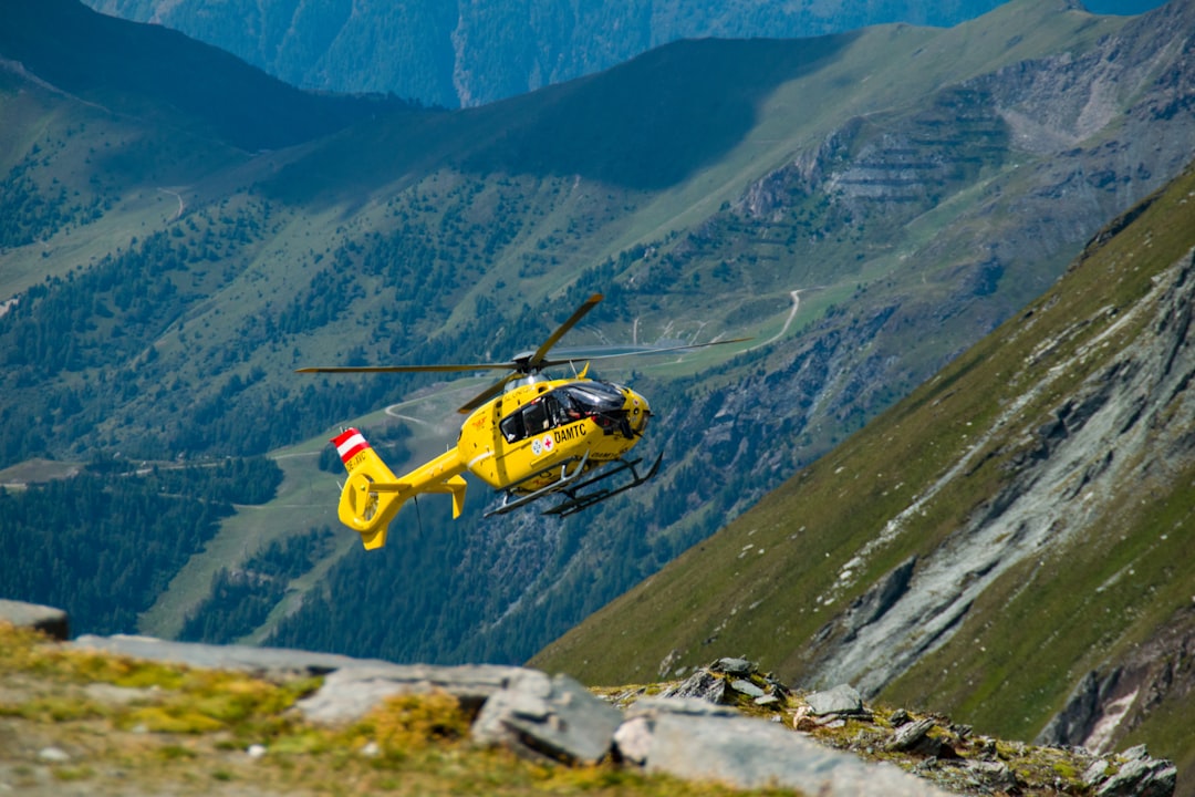 yellow helicopter in the air,