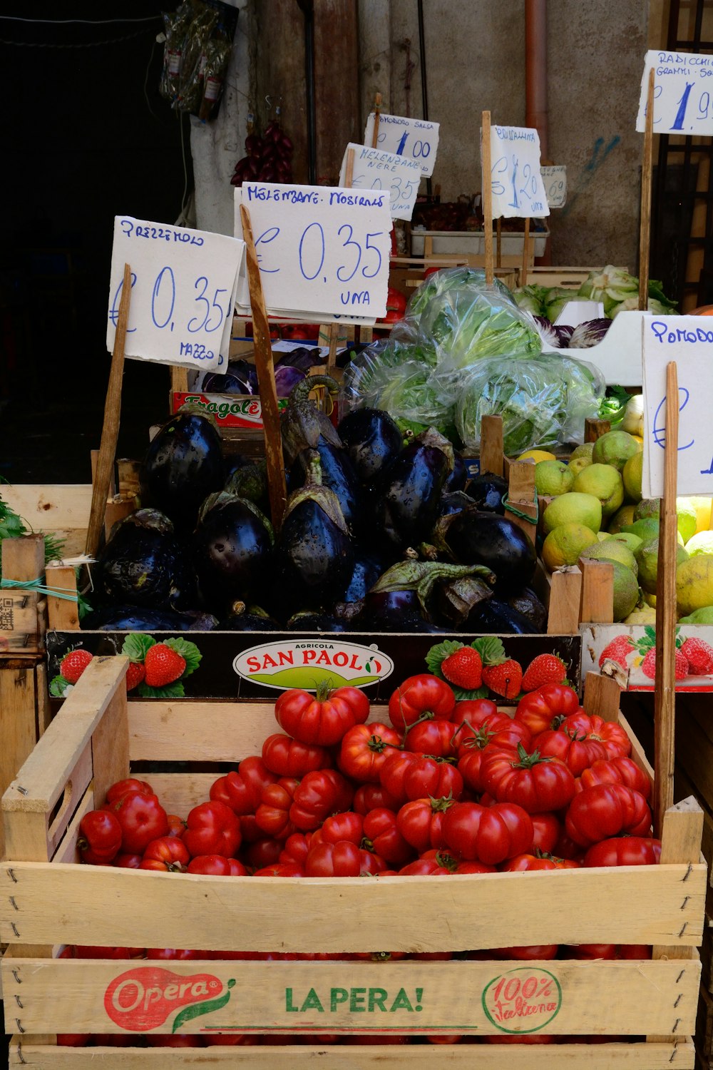 assorted fruits on brown wooden crate at daytime