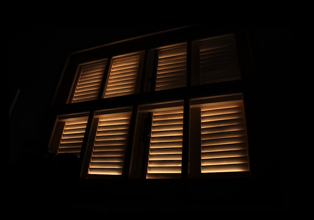 closed beige wooden window curtain