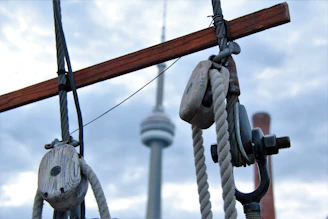 Close-up of elevator cables and pulleys during maintenance work.