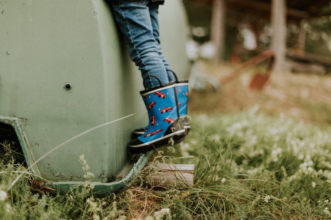 person wearing rain boots