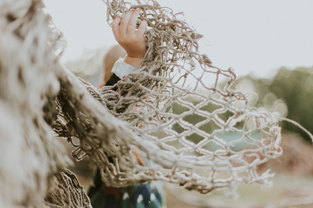 selective focus photography of white hammock