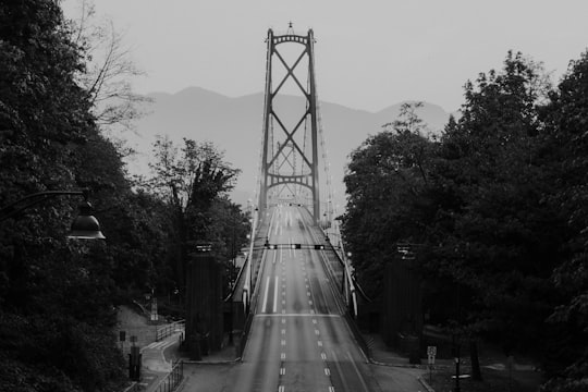 grayscale photography of suspension bridge in Lions Gate Bridge Canada