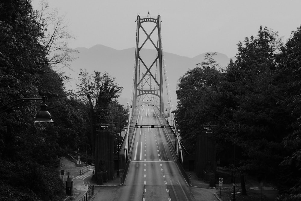 grayscale photography of suspension bridge