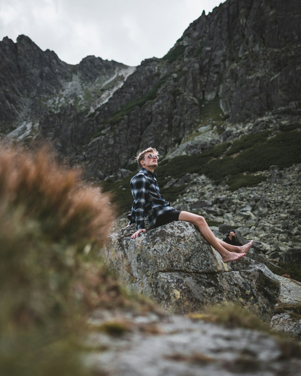 person sitting on rock