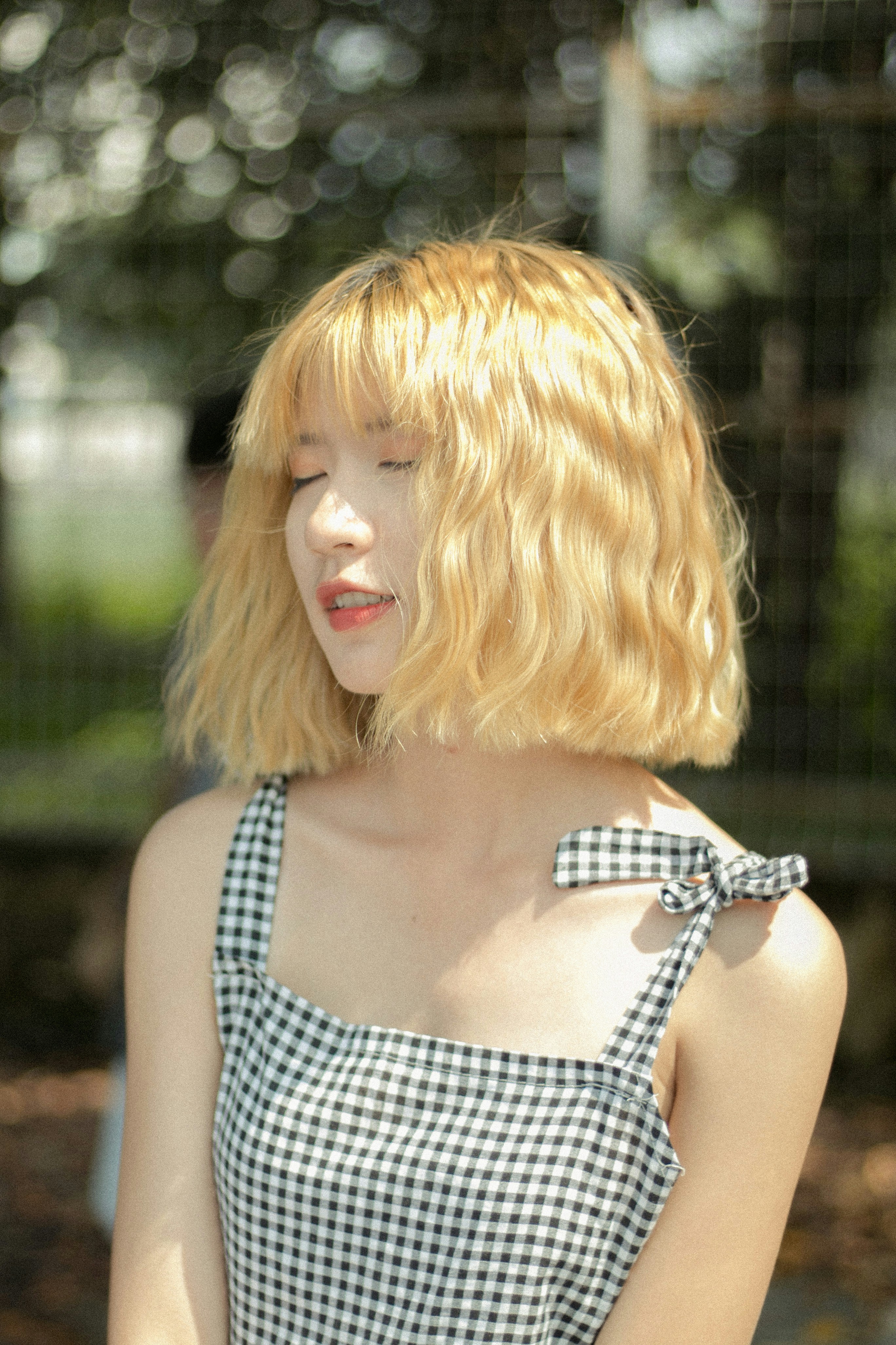 woman closing eyes at daytime