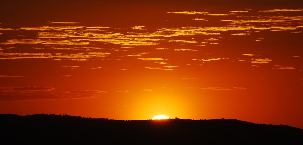 sunset behind mountain