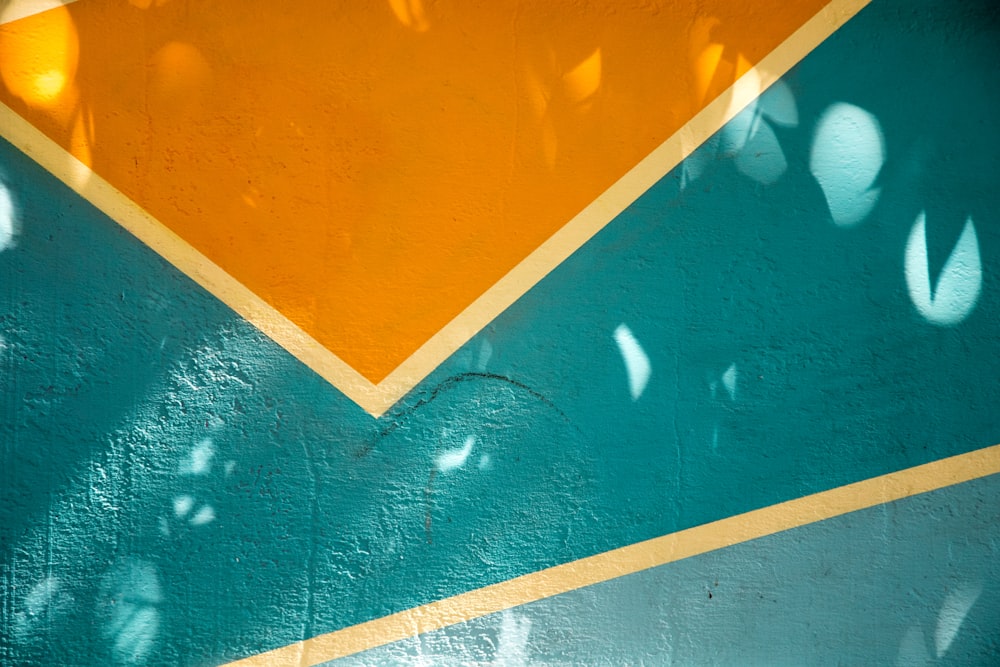 a yellow and green wall with a clock on it