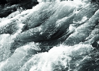 flowing body of water during daytime