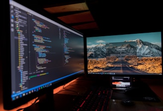 two black flat screen computer monitors