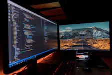 two black flat screen computer monitors