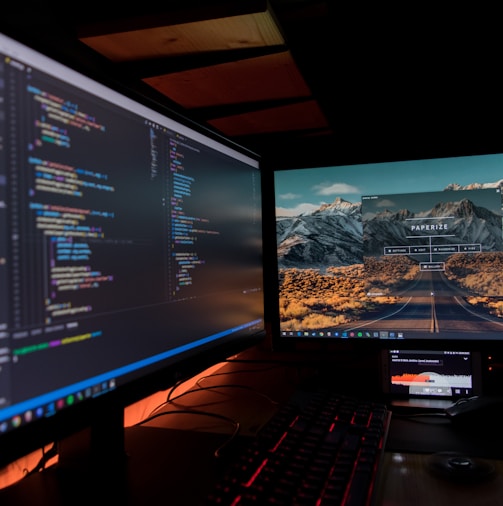 two black flat screen computer monitors