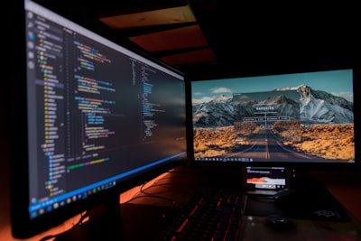 two black flat screen computer monitors programming zoom background