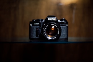 black Richo LSR camera on table