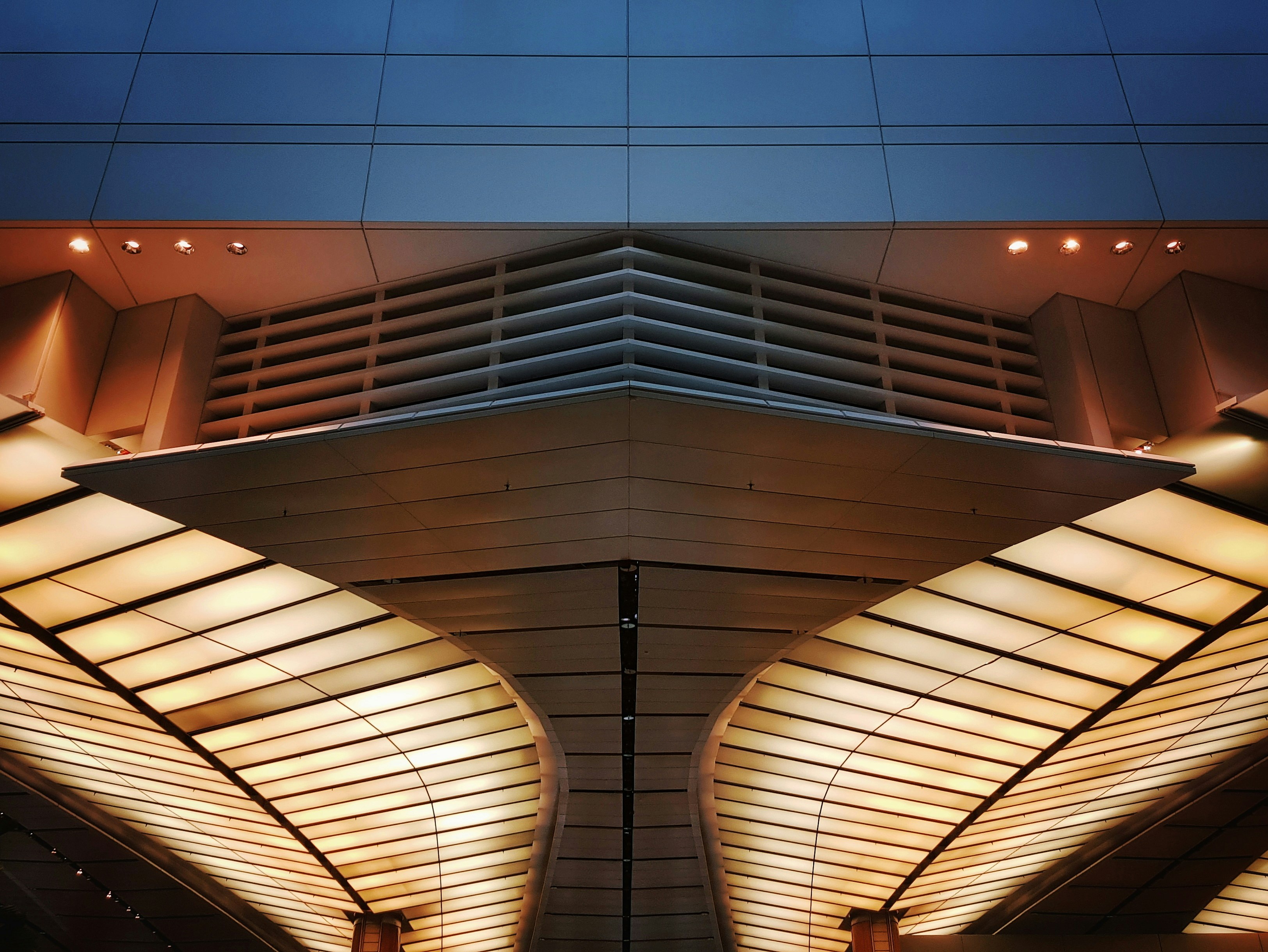 low angle photo of white ceiling structure of a building