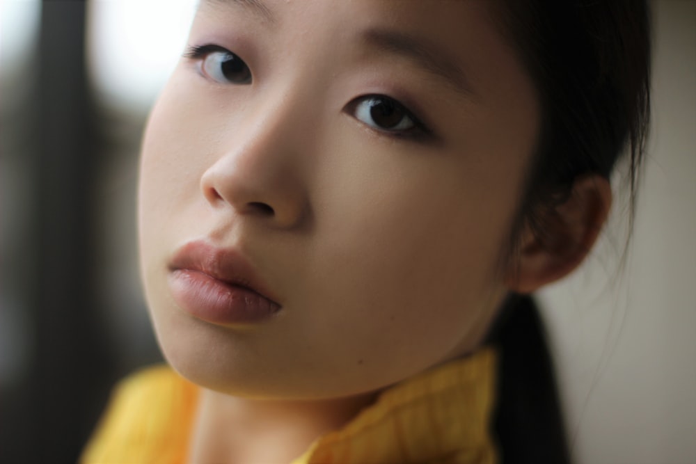 woman wearing yellow top