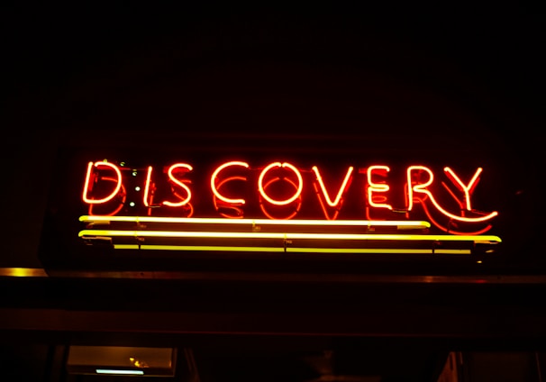 lighted red Discovery neon signage