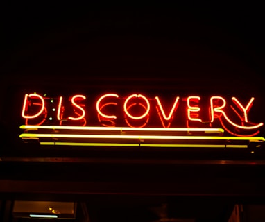 lighted red Discovery neon signage