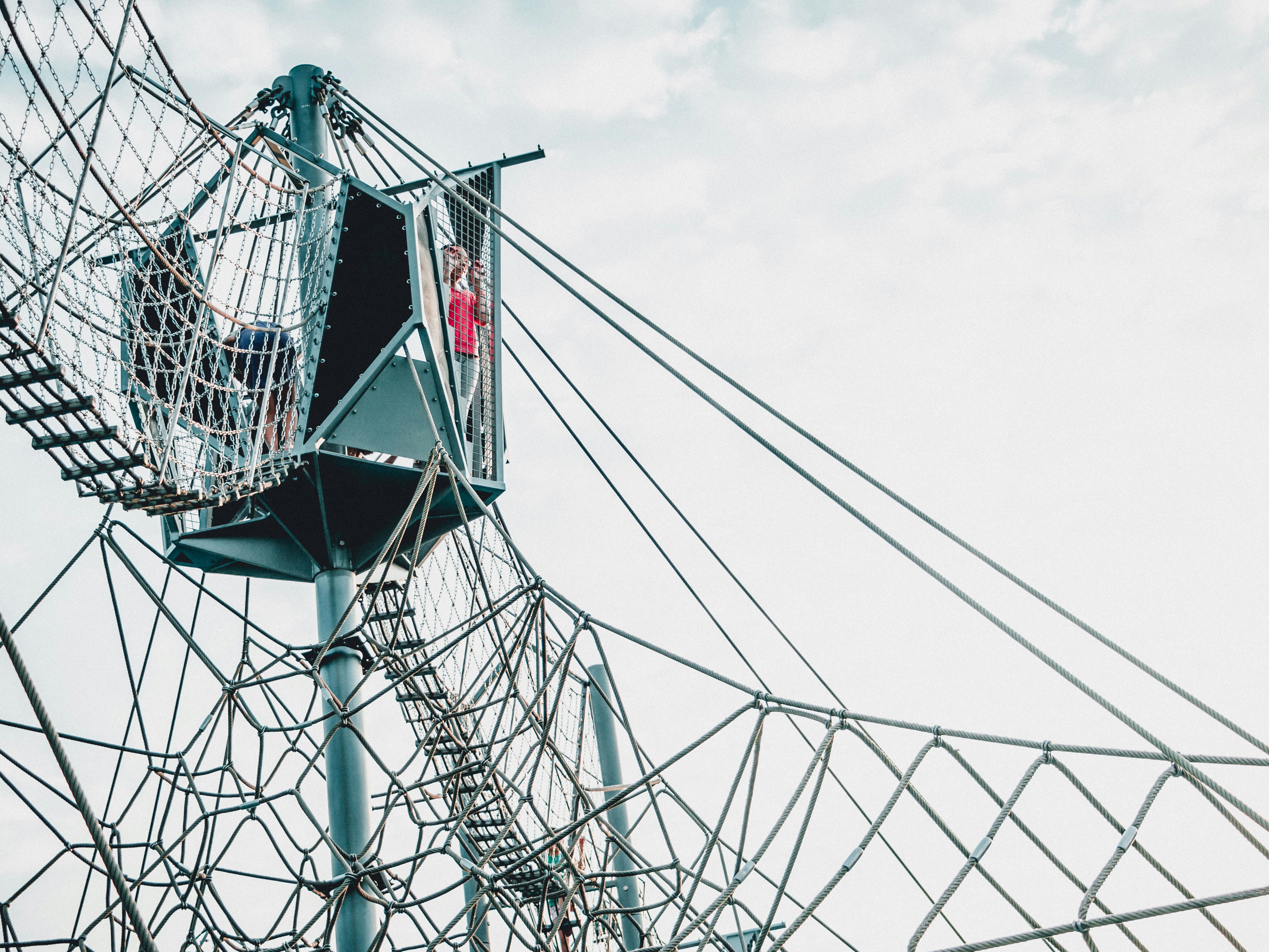 woman standing on green steel stand