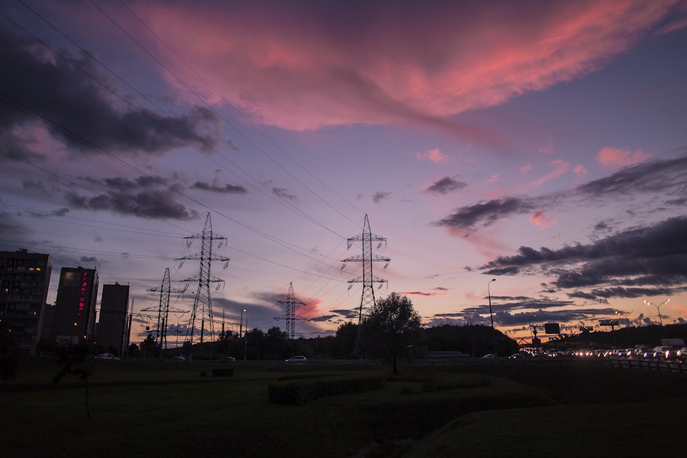 silhouette photography of electrical posts