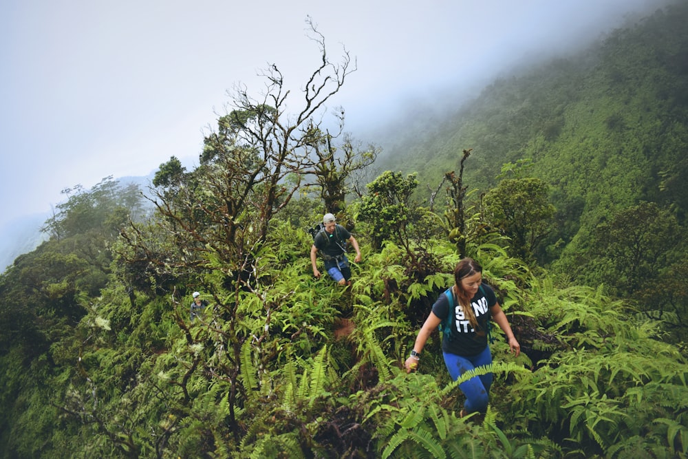 man and woman trekking