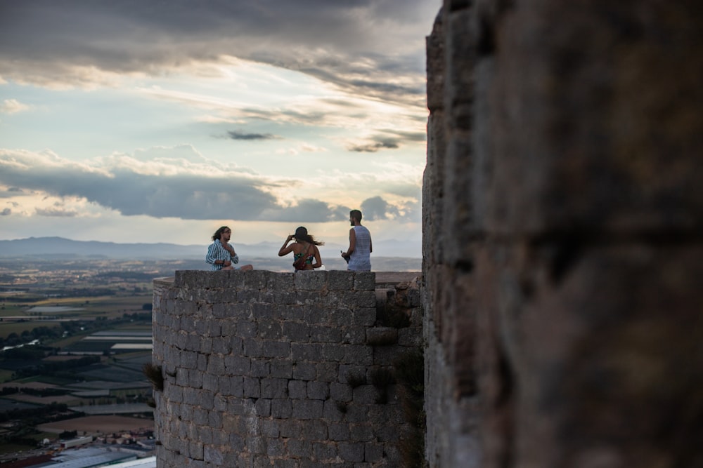 three people on the peak