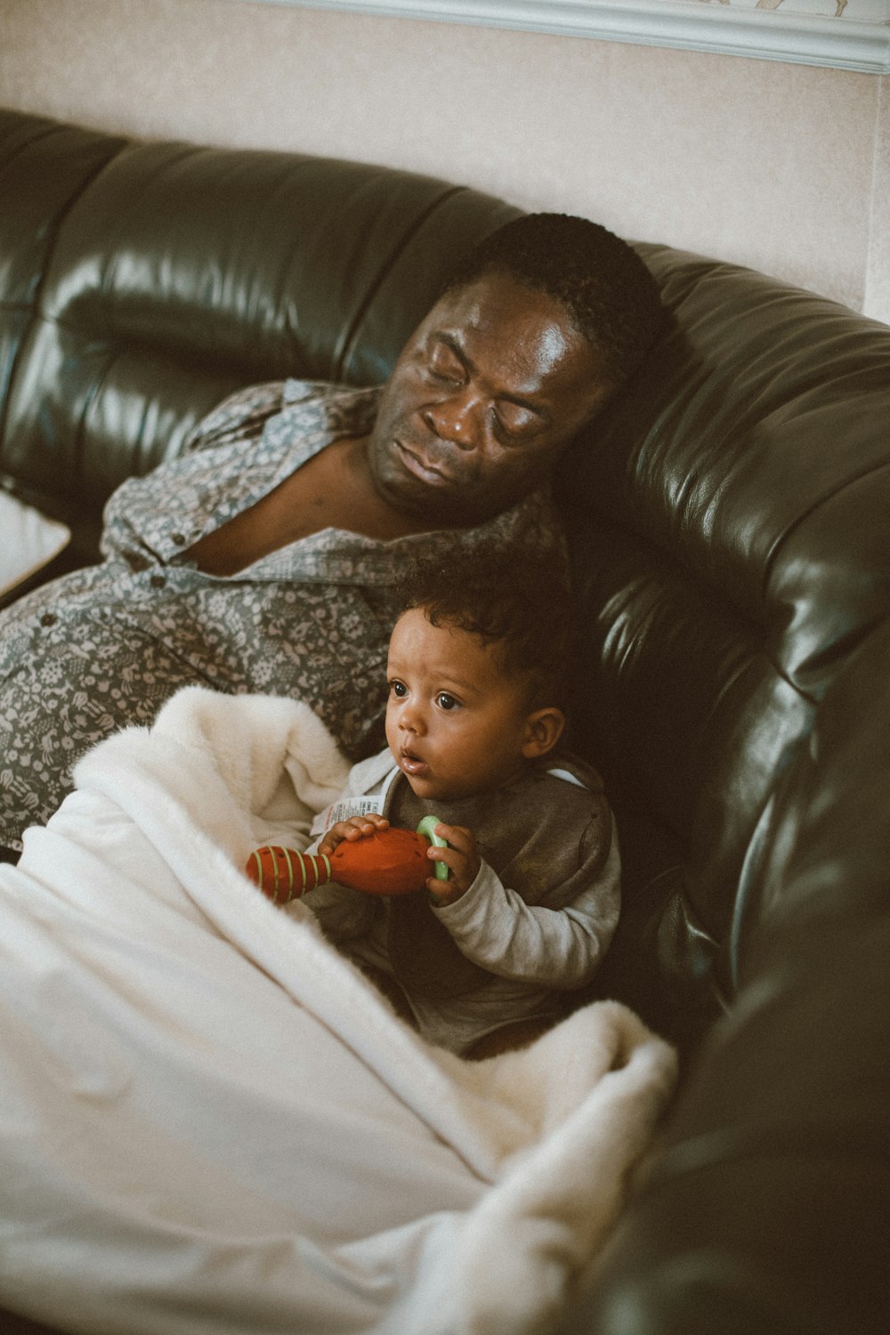 man sleeping on couch