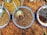 Close-up of vibrant assorted spices in wooden bowls on a rustic table.