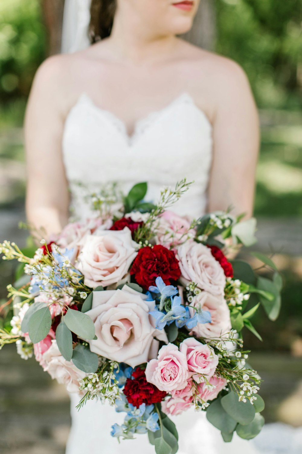 woman holding flower bouquet