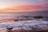 body of water during sunset