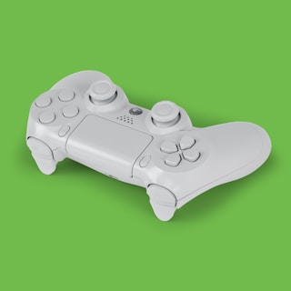 A white gaming controller is placed against a solid green background. The controller features buttons, thumbsticks, and a touchpad, which are all clearly visible.