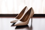 pair of women's brown pointed-toe pumps on board